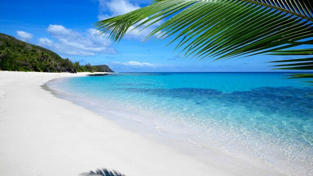 A white sandy beach with blue ocean