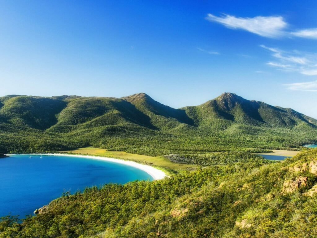 The view of Wineglass Bay with the white beach and green nature