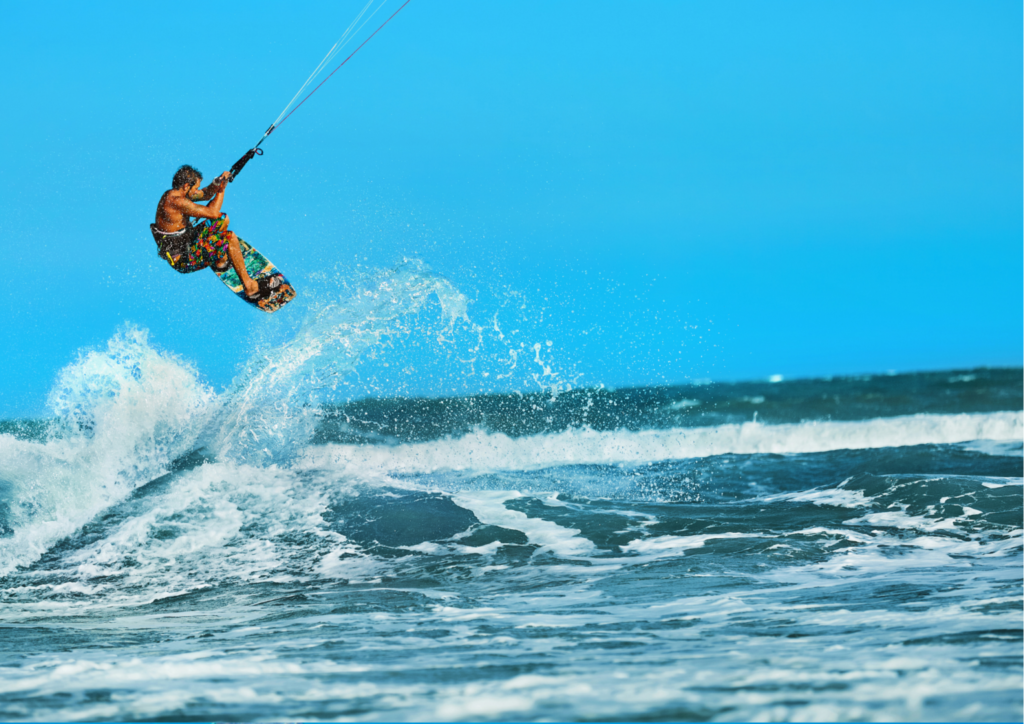 Kite boarder jumping in the ocean