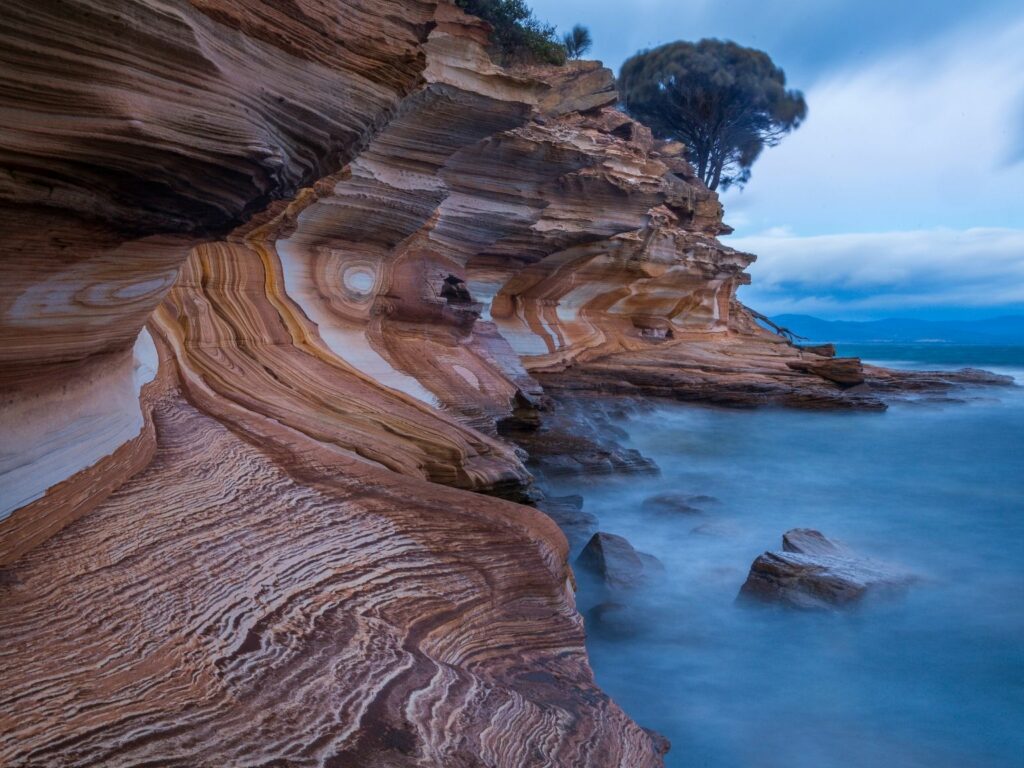 The Painted Cliffs, a set of spectacular cliffs in beautiful white and sandy hues in Maria Island
