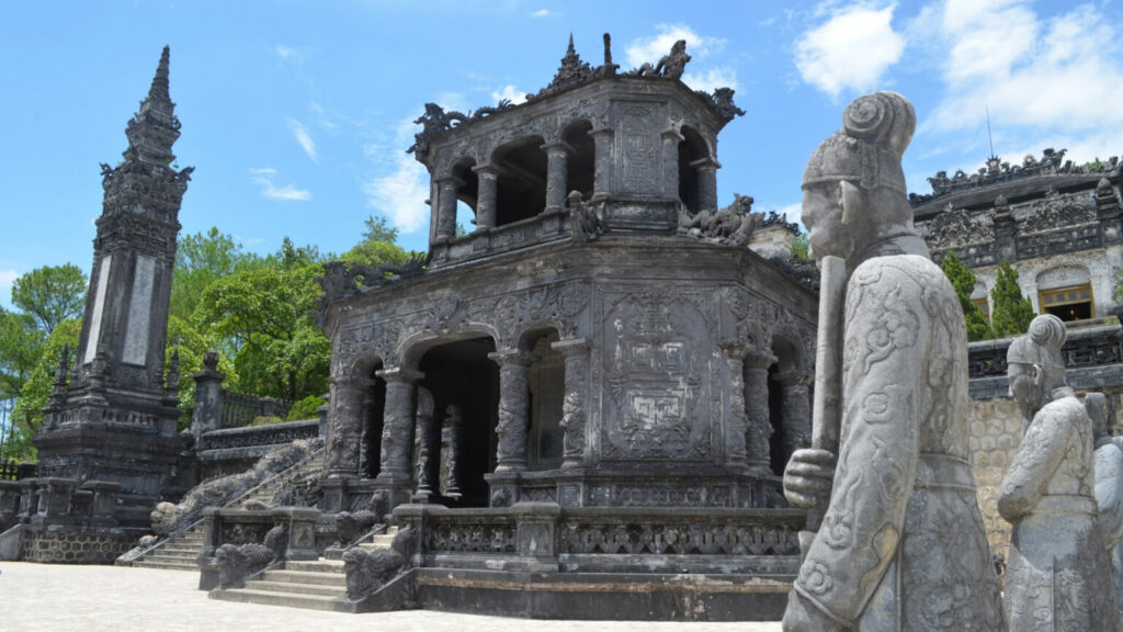 Tomb structure of Khai Dinh Tomb in Vietnam with two statues in front