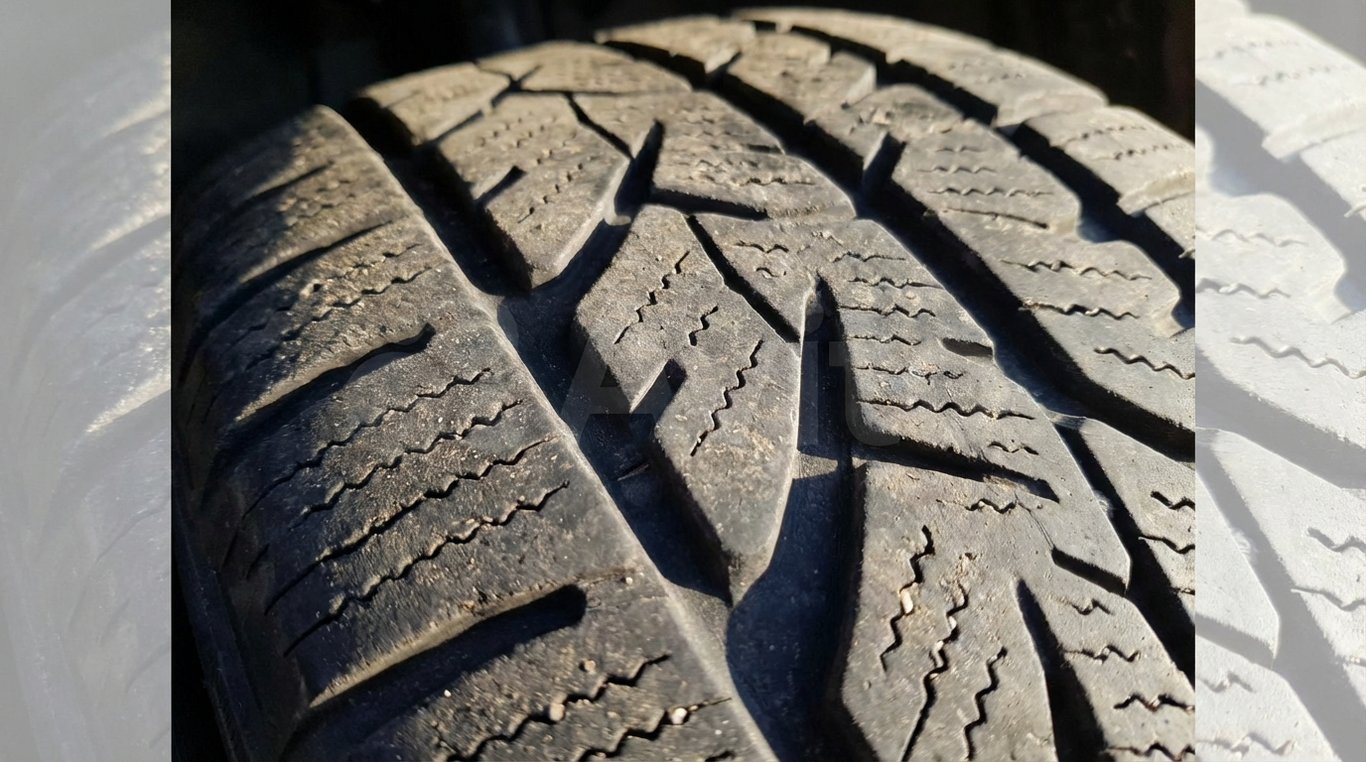 Close-up of a tyre tread designed for wet and winter conditions
