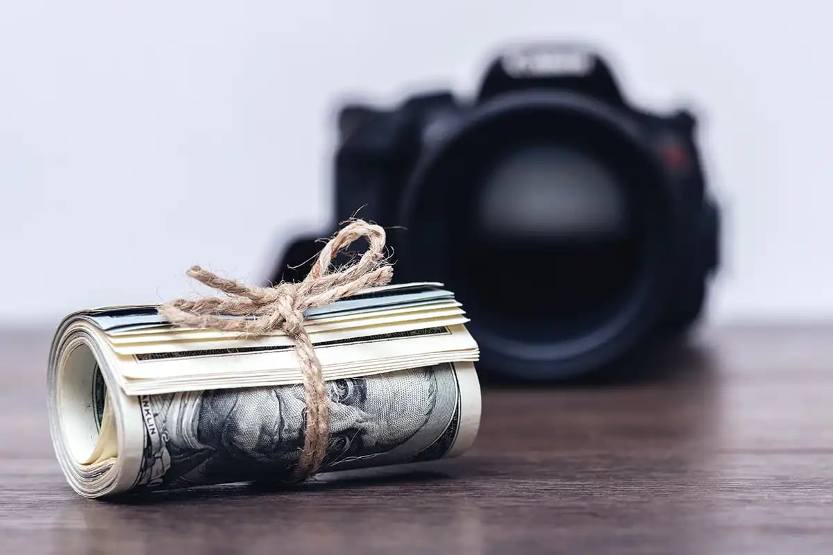 Roll of money in front of a camera