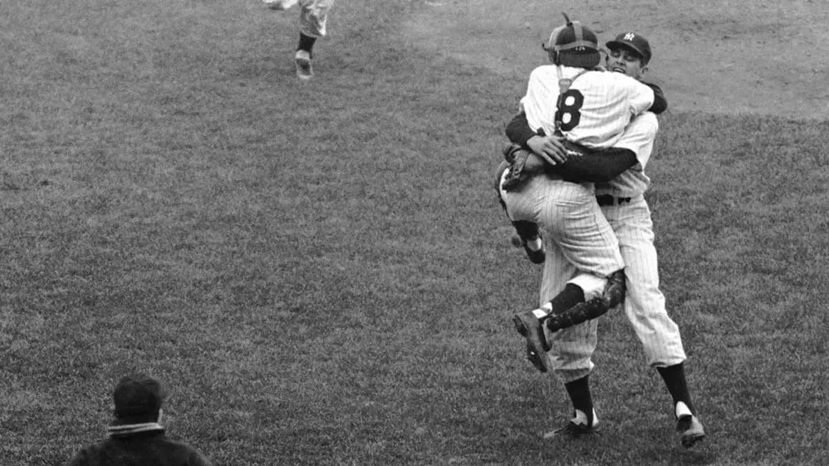 two baseball players, one wearing number 8, celebrating in black and white