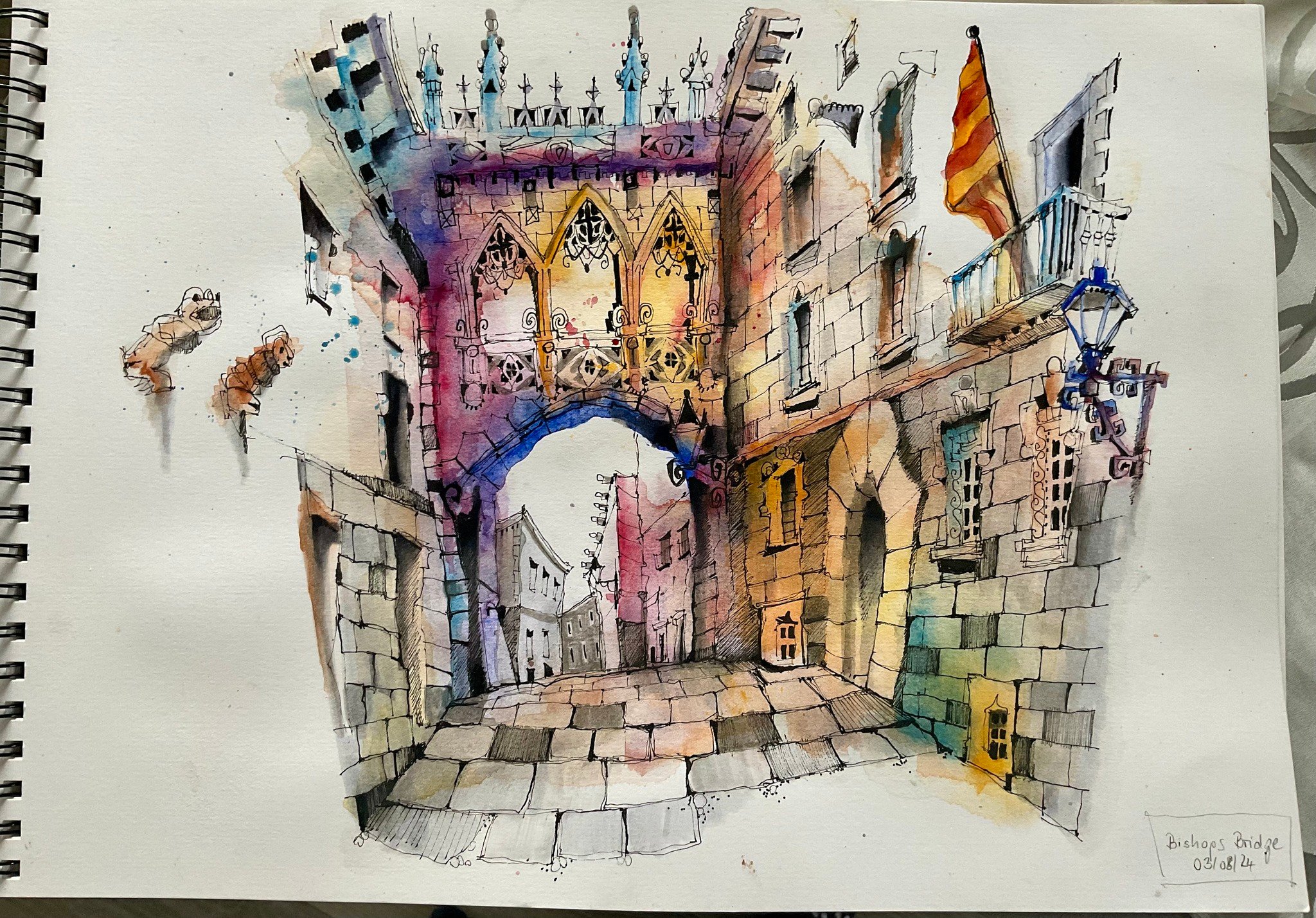Watercolour sketchbook drawing of a stone bridge archway connecting two Gothic-style buildings above a narrow street, with tracery windows, a hanging flag, and a street lamp