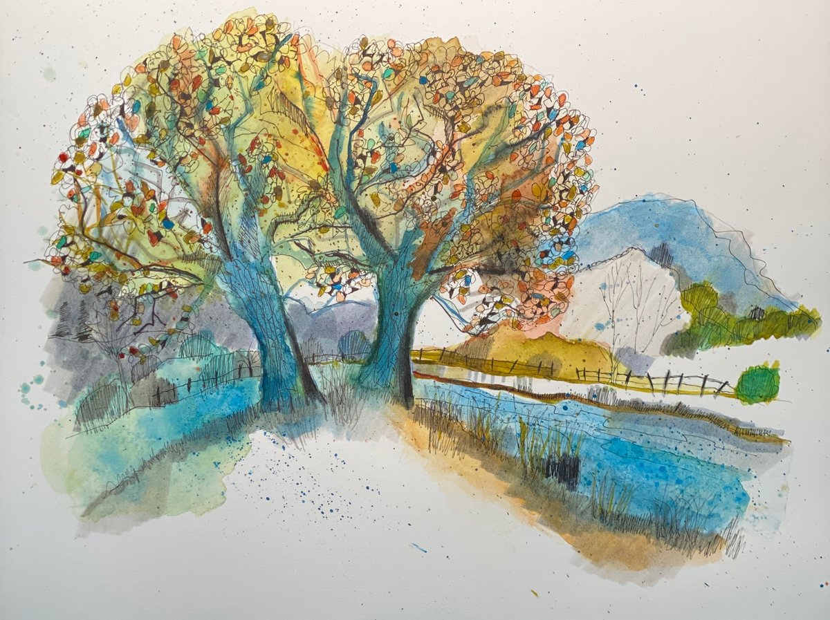 A beautiful watercolor and pen sketch of a pastoral landscape featuring a large tree with luminous golden-yellow foliage dotted with orange and red autumn leaves. A winding blue stream runs through the foreground with grassy banks, pastoral fencing, and rolling hills with mountains in the background. The composition demonstrates masterful layering of transparent watercolor washes in blues, yellows, and warm earth tones with detailed pen line work throughout, creating depth and capturing a serene countryside setting with botanical precision and artistic sensitivity.