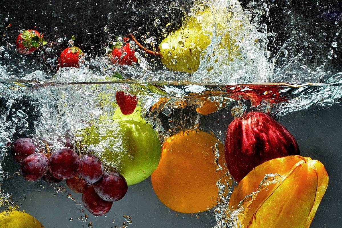 A fruit splash underwater &mdash; an artistic photograph from the iPhotography Home Projects Course.
