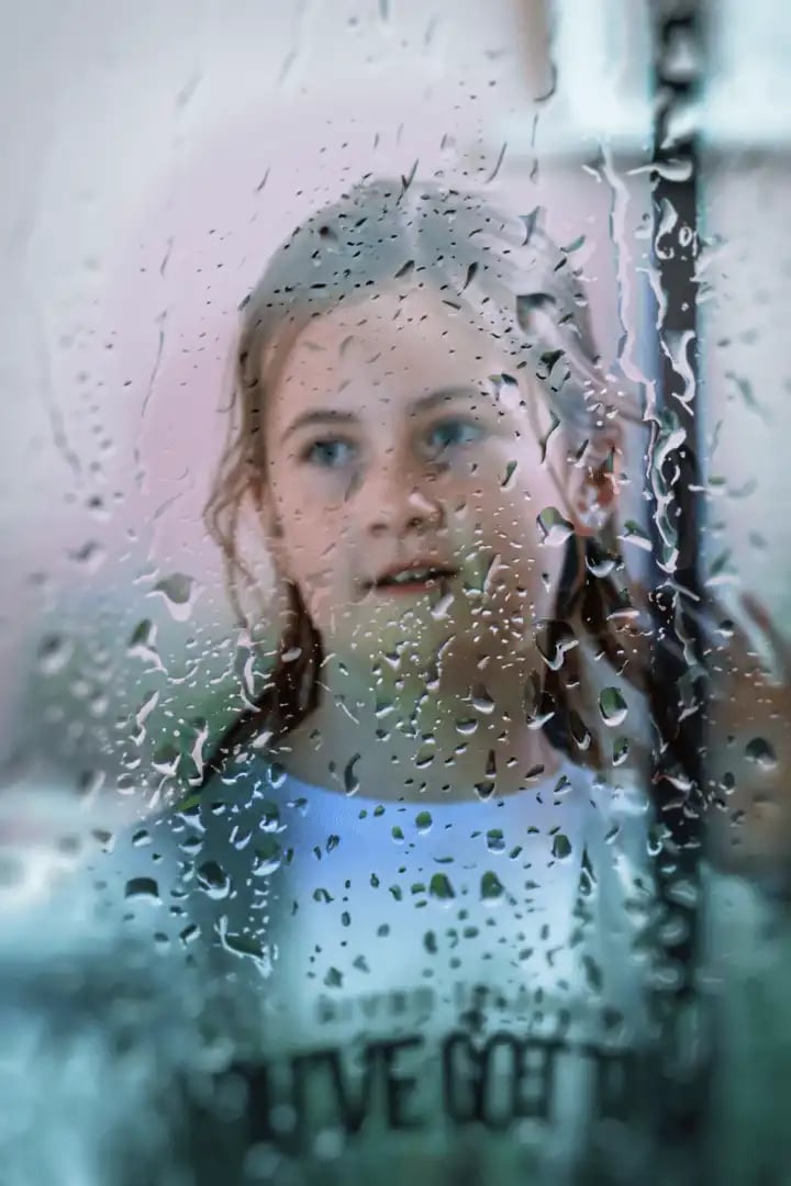 Looking Through Glass with Rain on