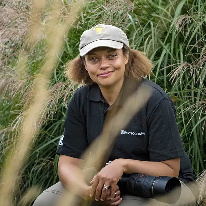 Rachel Sinclair, Wildlife and Safari Photography Course Instructor, in the field with her camera.