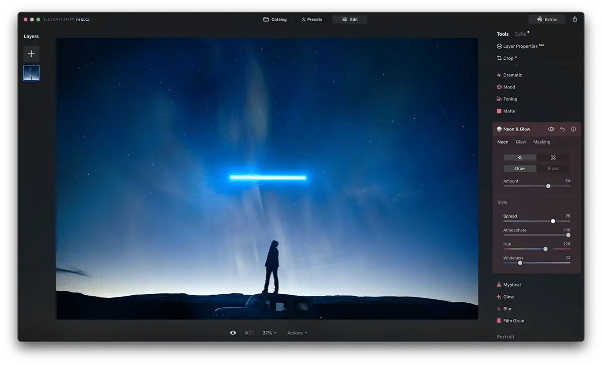 Screenshot of Luminar Neo Neon Glow Effect with a blue glowing bar above a person stood on a car roof at night time. Stars are in the sky.