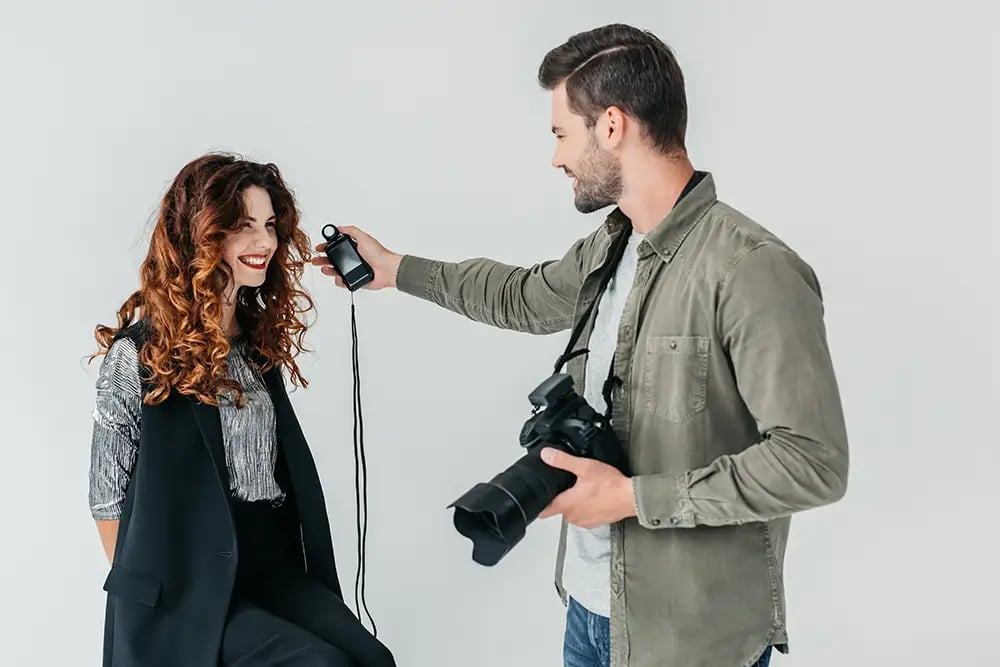 Photographer Using a Light Meter