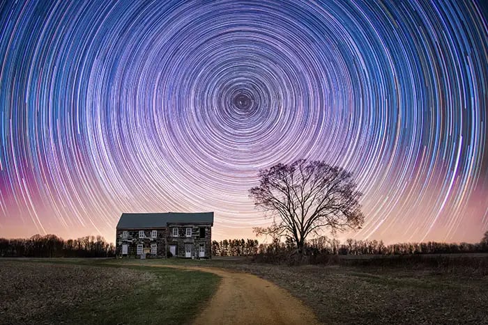 A star-trail photograph &mdash; a long exposure of the night sky showing the rotation of the stars.