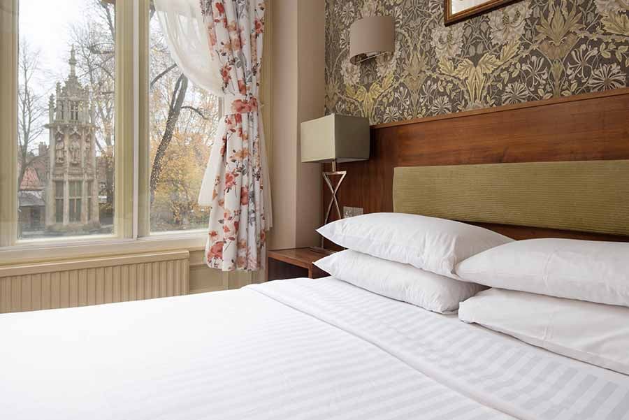 A bedroom at Dean Court Hotel, York