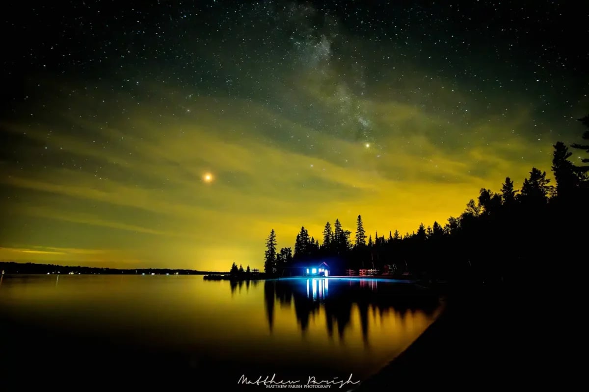 Long-exposure astrophotograph over water by iPhotography Member Matthew Parish.