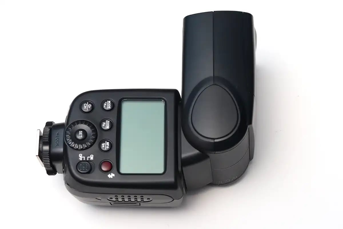 an overhead view of an off camera flash with the flash head tilted