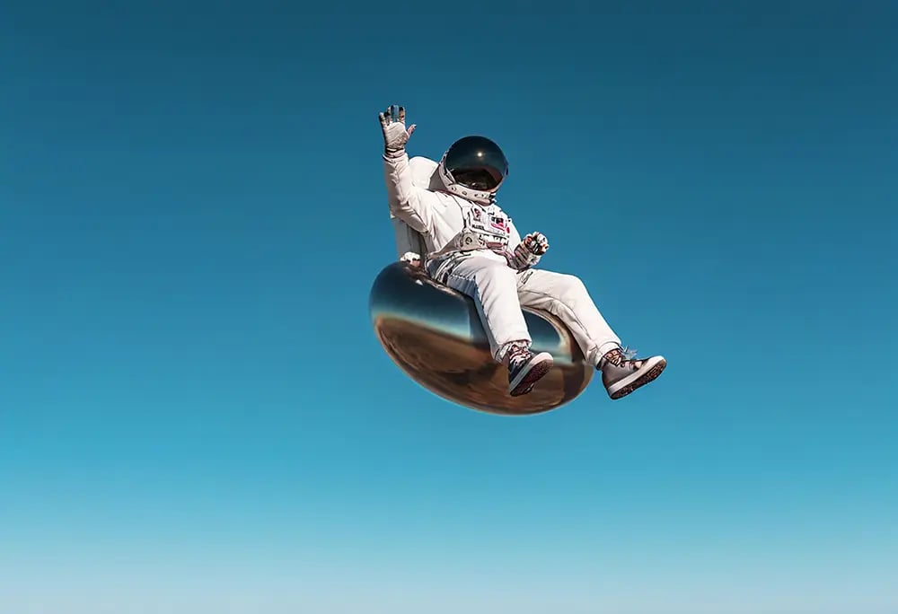 Depositphotos Astronaut floating in the sky on a metal seat