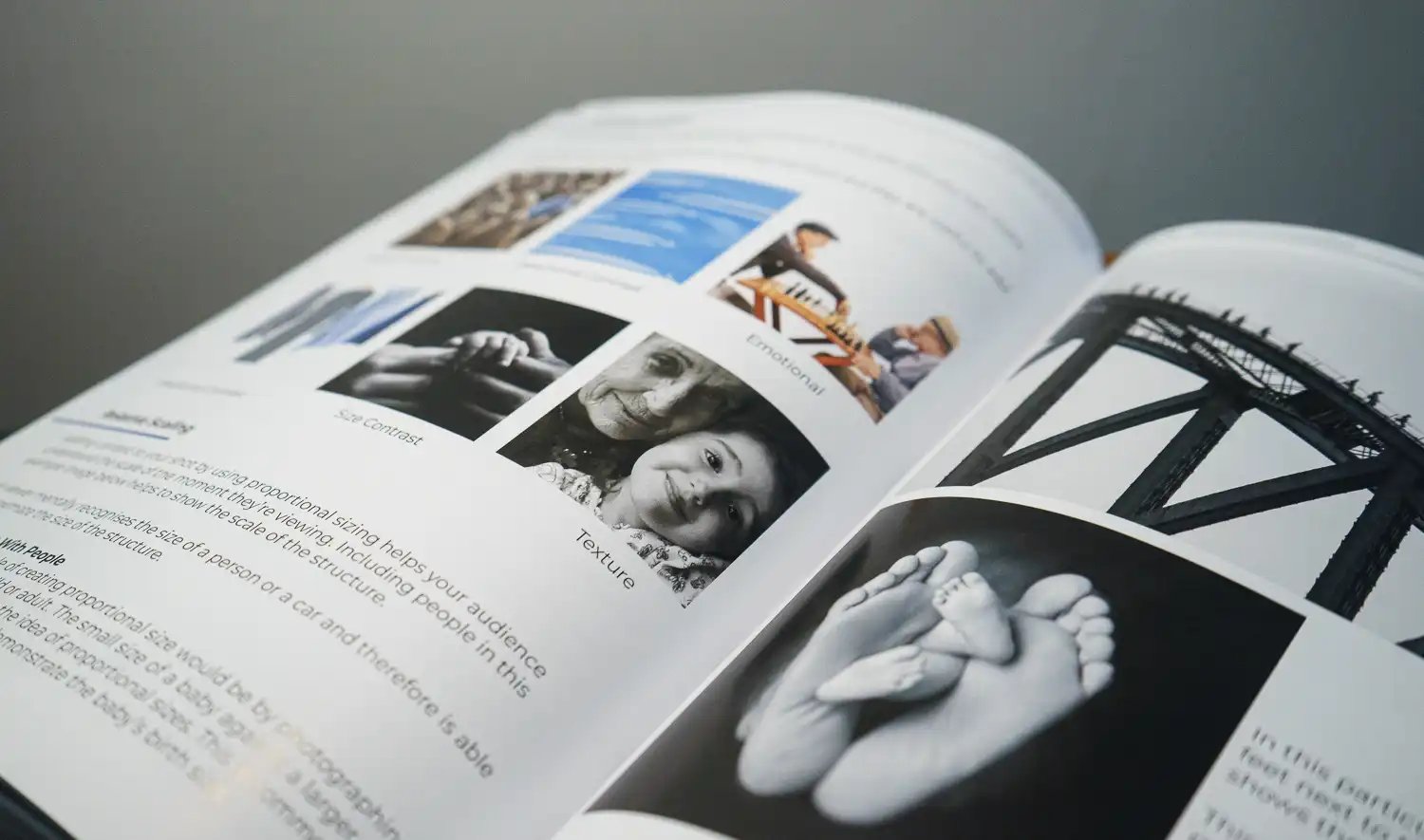 The iPhotography Photography for Beginners textbook, an A4 hardback, open on a table.