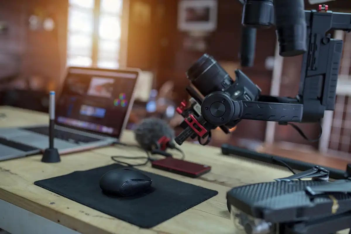 Desk with Vlogging equipment camera, microphone and laptop