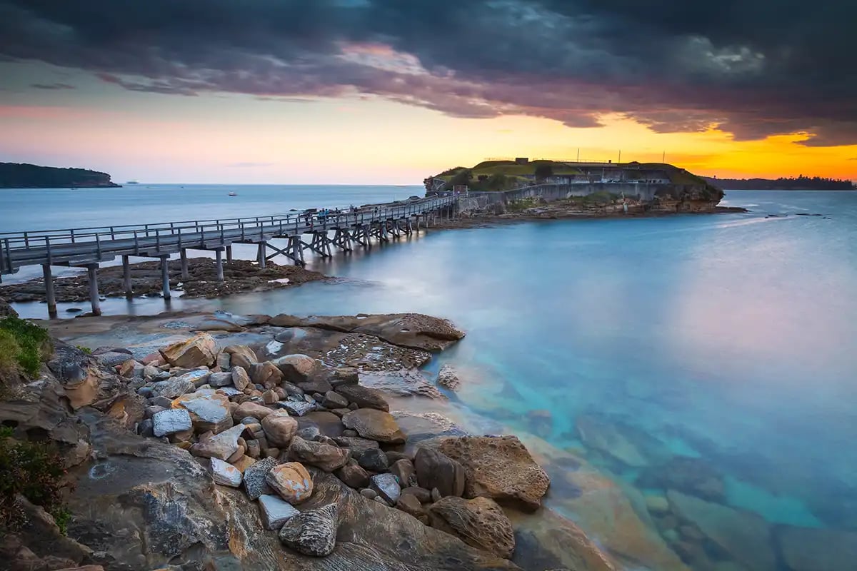 Seascape with a moody sky at sunset
