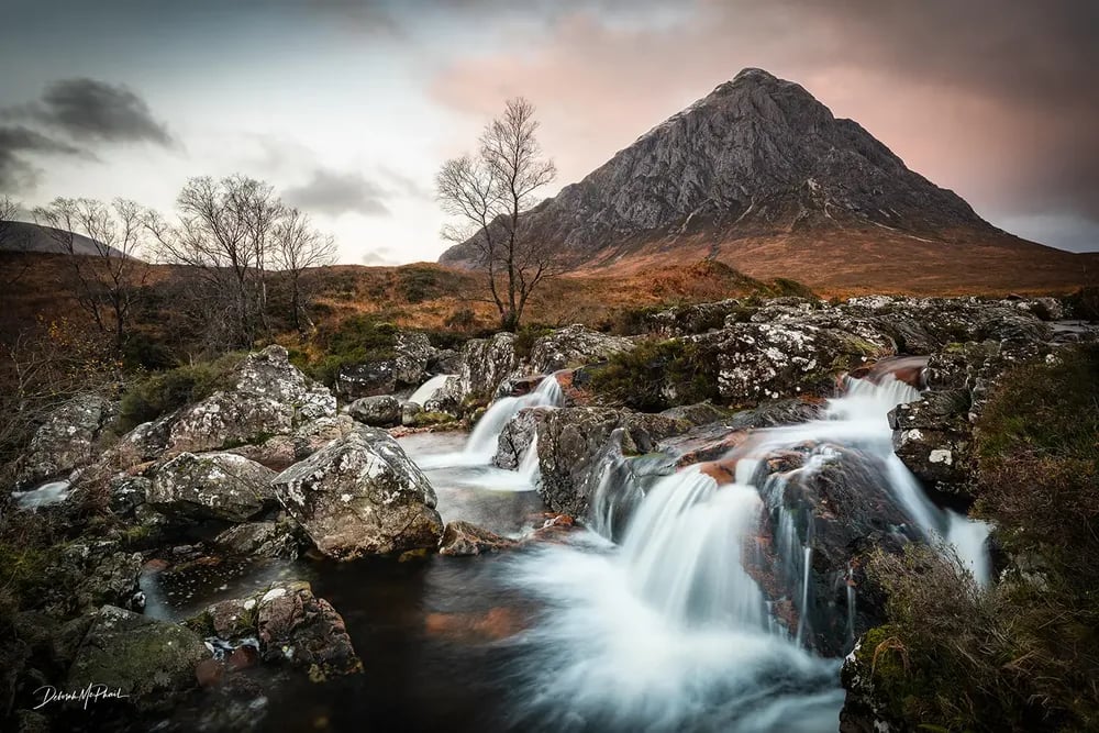 Deborah's recent landscape — long-exposure Glencoe sunset with Buachaille Etive Mòr rising into a moody amber sky.