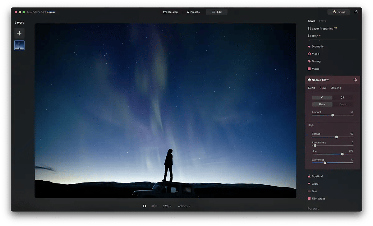 Screenshot of Luminar Neo Neon Glow Effect with a blue glowing bar above a person stood on a car roof at night time. Stars are in the sky.