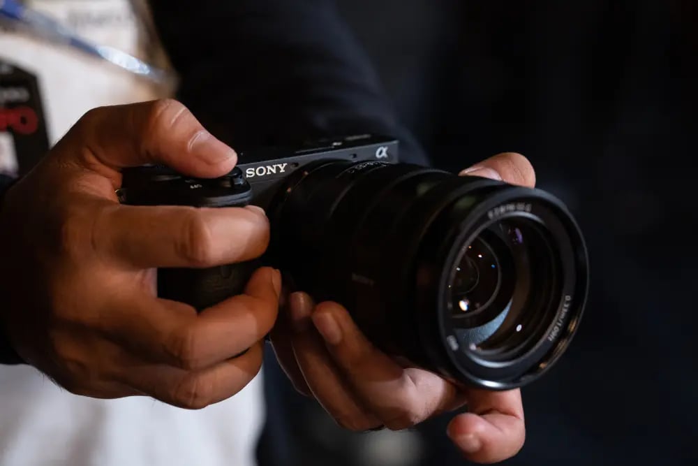Sony Alpha camera in hands