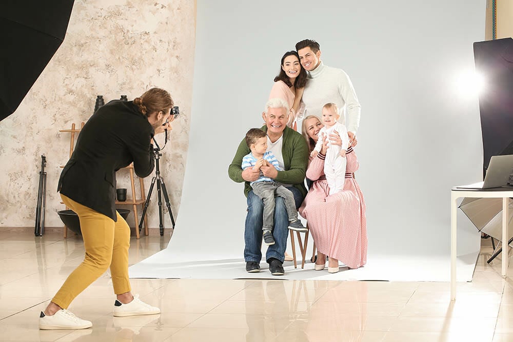 Photographer working with family in studio