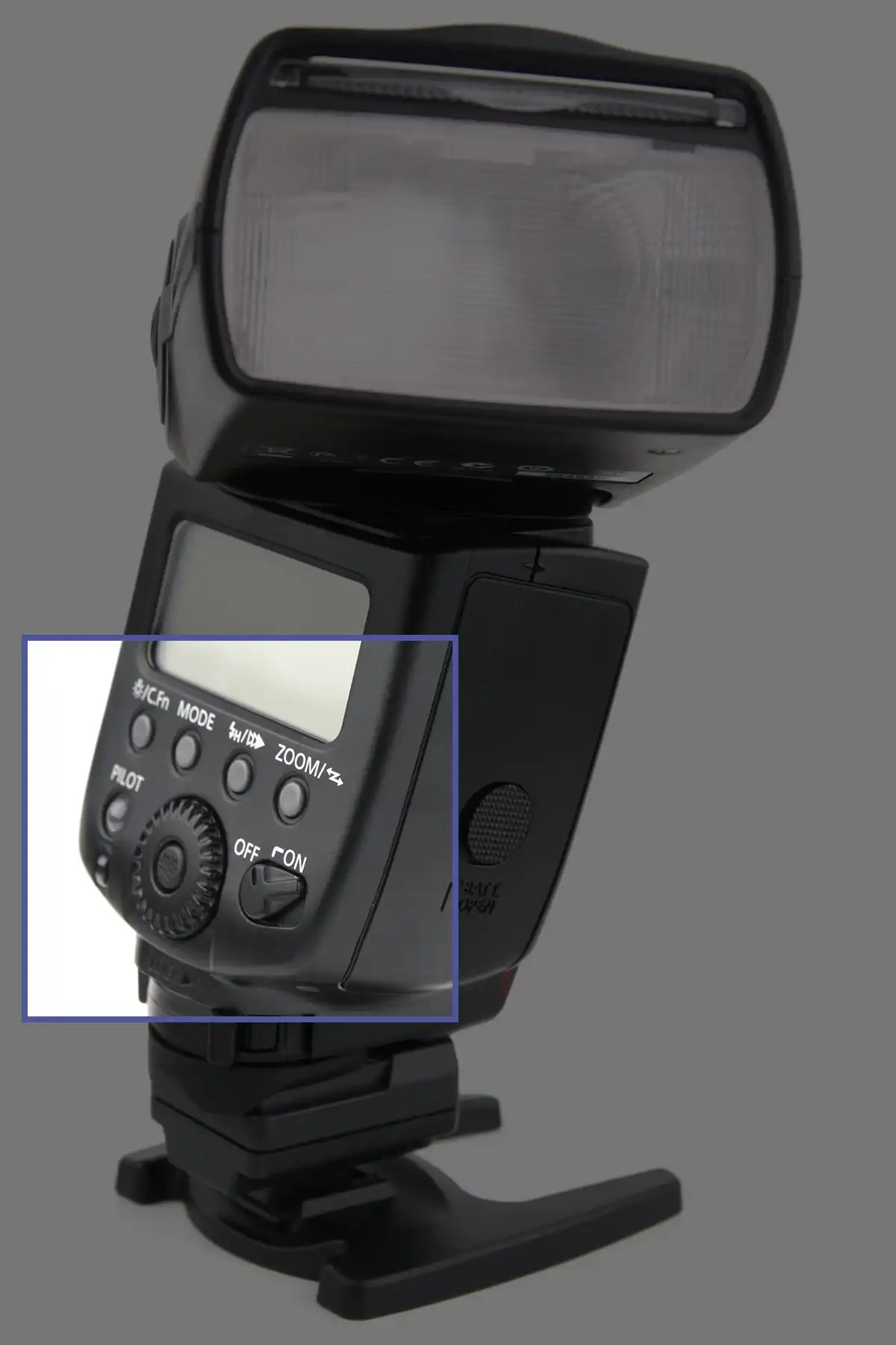 Close up of buttons on the back of a camera flash