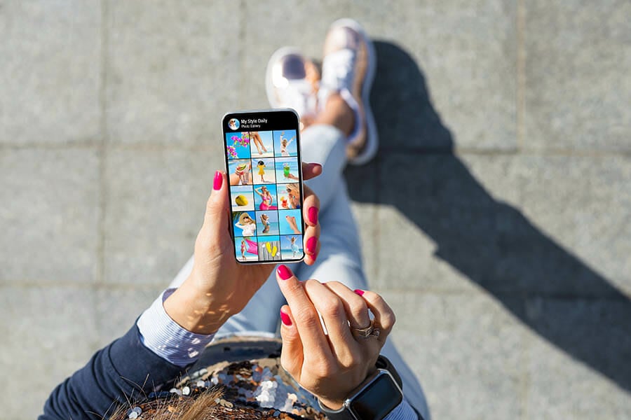 Woman viewing photo gallery posted on social media