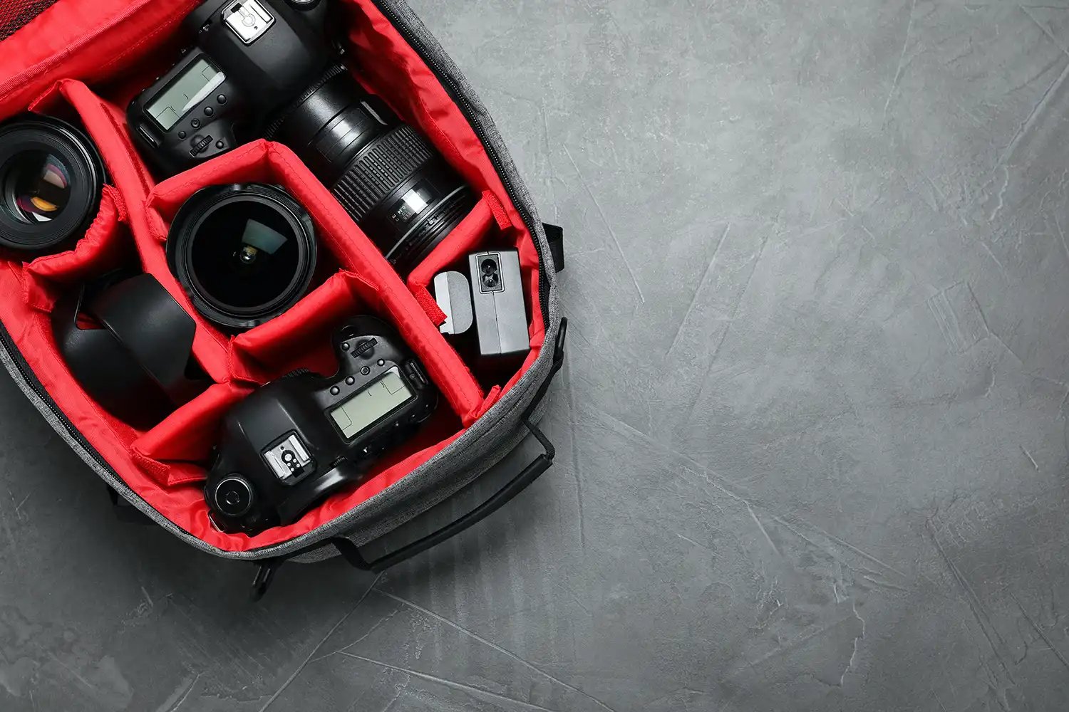 A camera bag with red inserts and cushioning