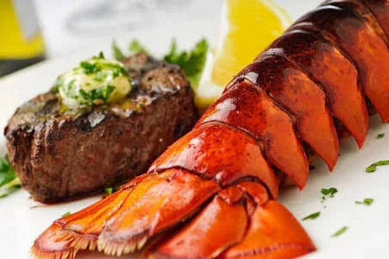 Surf and turf dinner with grilled steak, lobster tail, and herb butter—captured for Idaho food photography in Boise and the Treasure Valley.