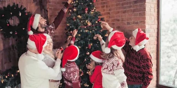 Christmas Portraits: Family Trimming Christmas Tree