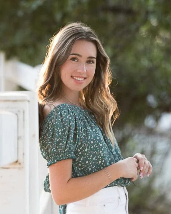 High School Senior Portrait: Senior Gal Leaning on White Fence