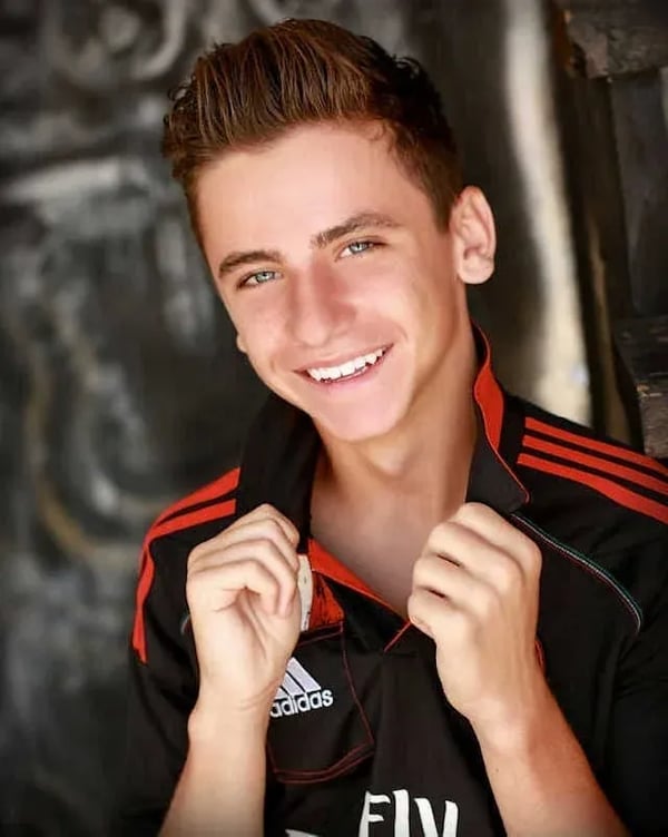 School Senior Portrait: Grad Grabbing Collar Looking Cool