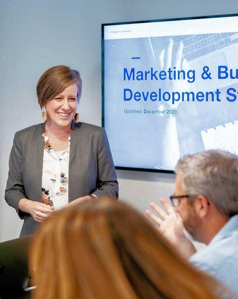Business Branding: Woman Giving Presentation with TV