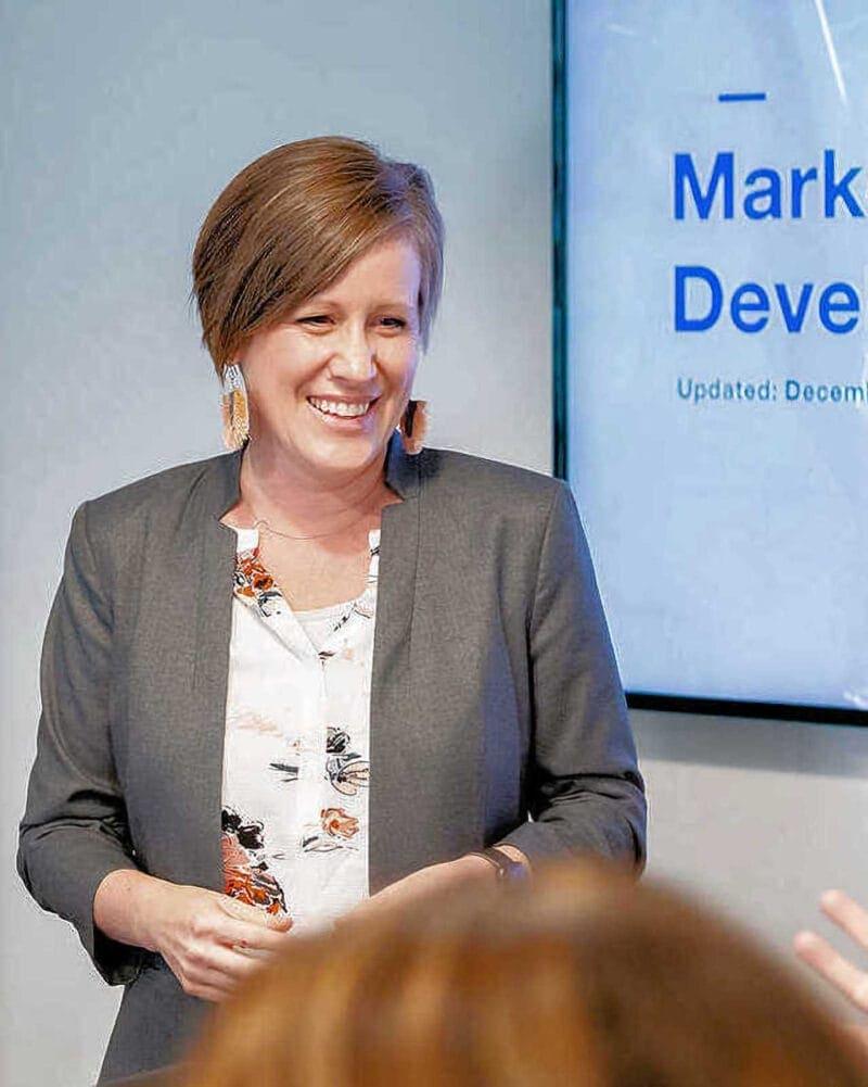 Business Branding: Woman Giving Presentation with TV (2)