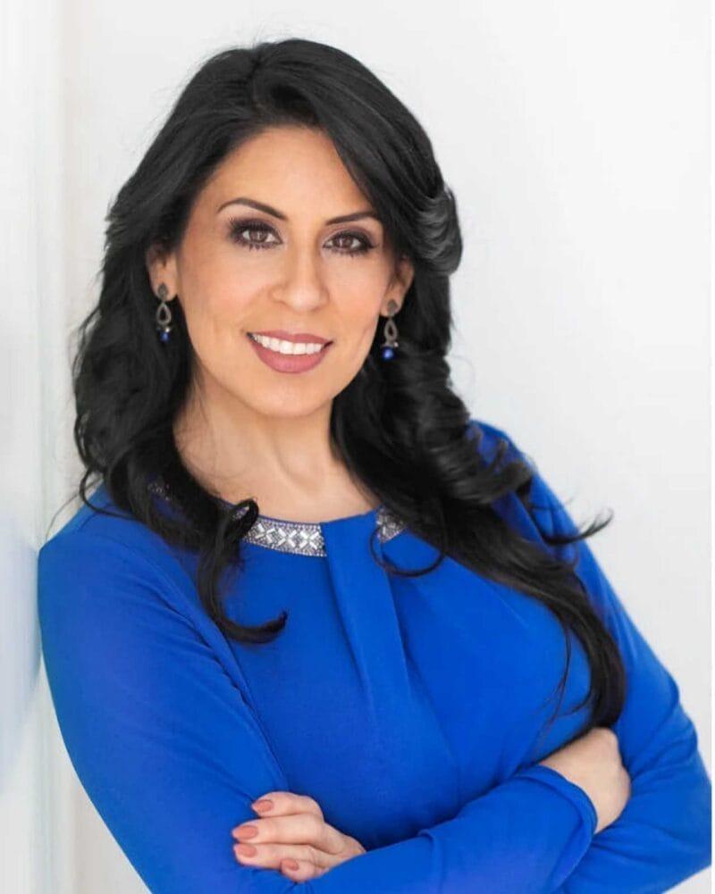 Title - OPT Business 3/4 Headshot: Woman Executive - Arms Crossed