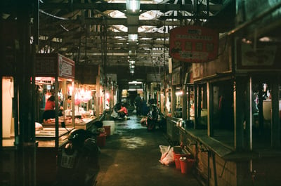 a inside of a dimly lit traditional market