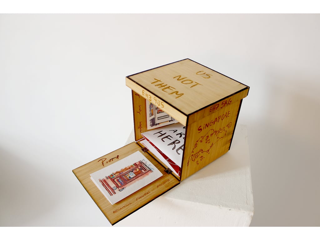 carmela.arguimbau “Us Not Them” Half Opened box view