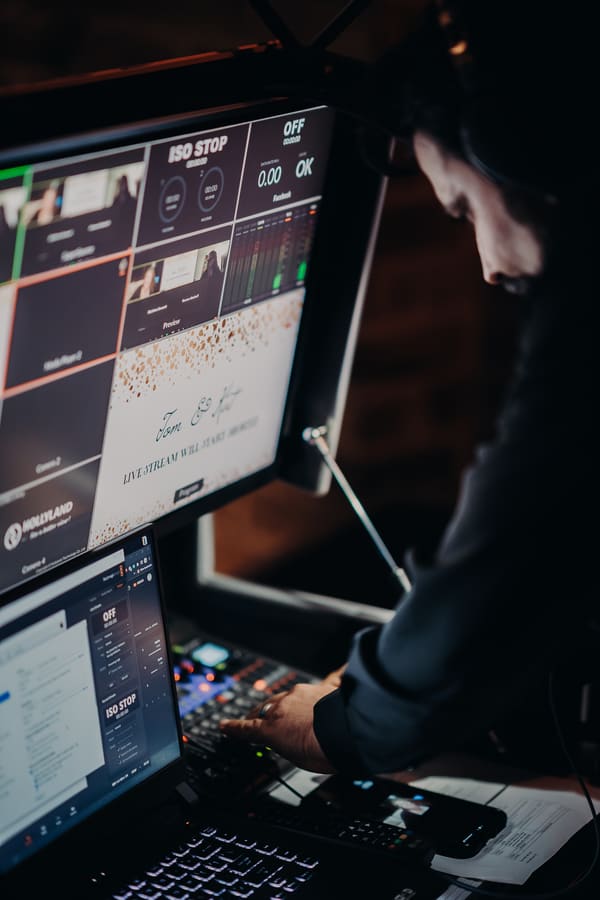 Close-up of Roman setting up a wedding live-streaming broadcast station
