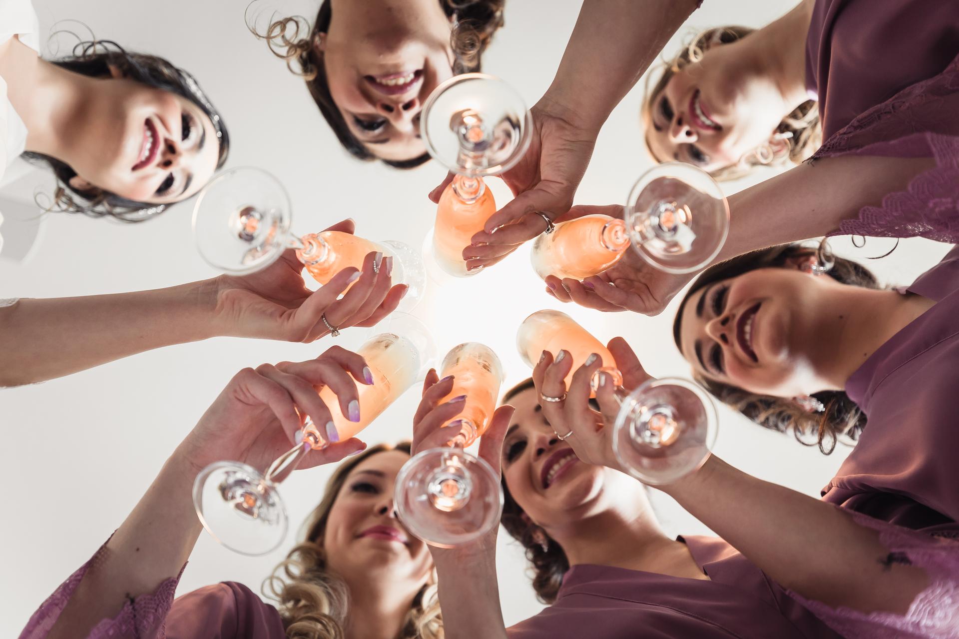 Bridesmaids raise champagne glasses in a toast at Hillstone St Lucia — The Quartyard.