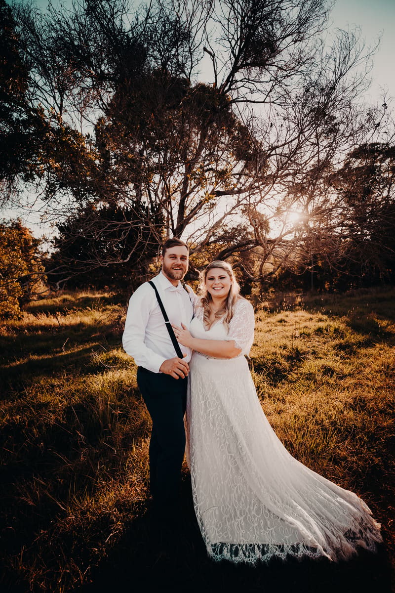 Annie and Trent pose together outdoors. Elopement photographer Brisbane by She Said Yes.