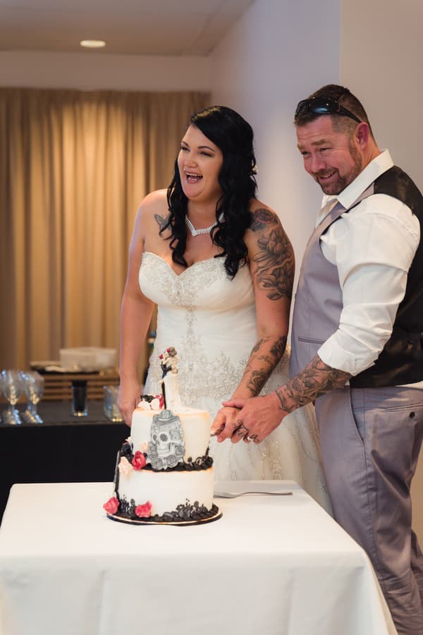 Bride Kelly and groom Shane cut their wedding cake at Novotel Sunshine Coast Resort during the reception.