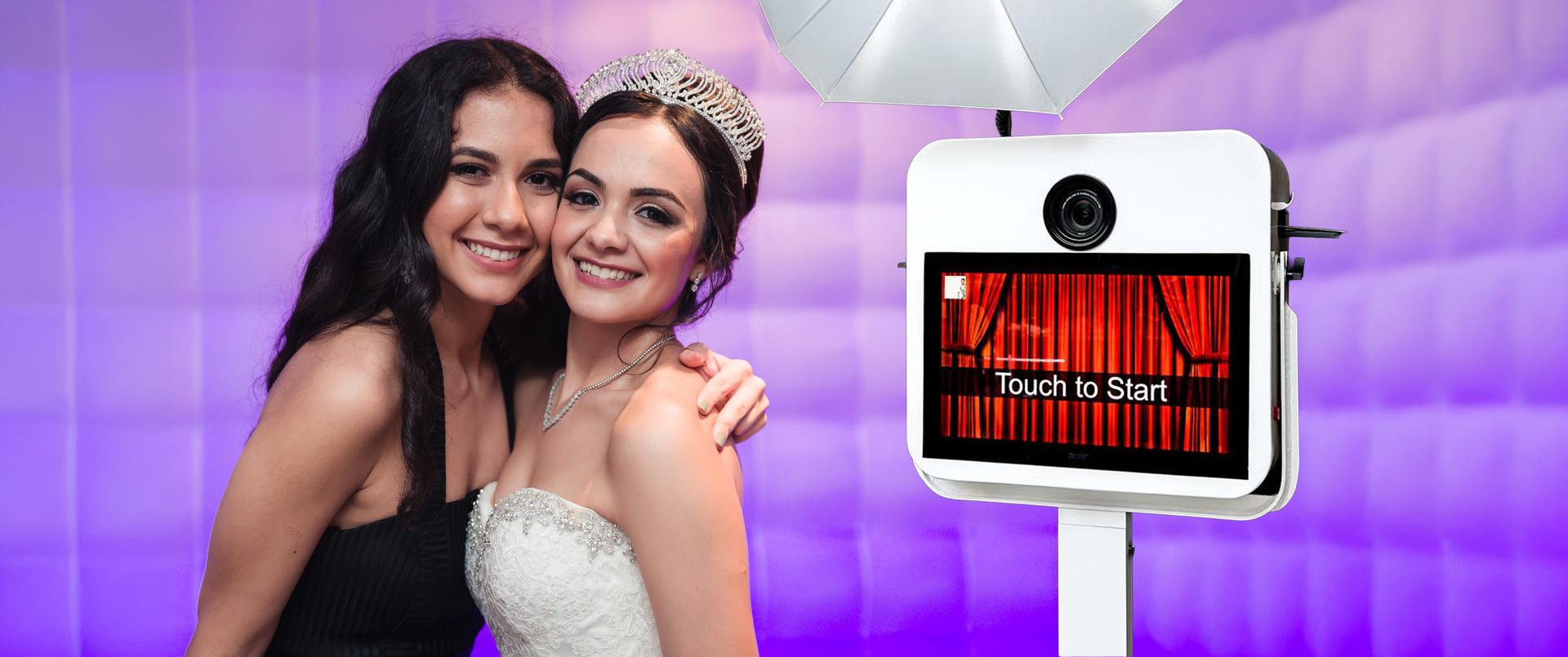 Bride and her best friend posing together in the photo booth with overlay