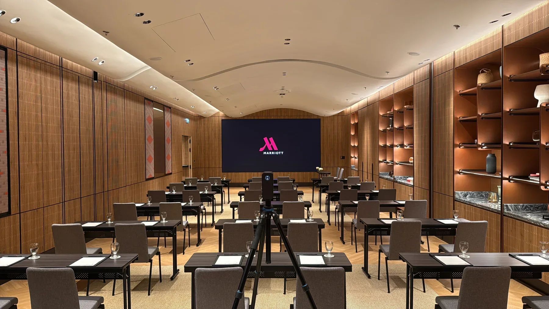 Matterport camera capturing a conference room at Chiang Mai Marriott Hotel, with classroom seating and a large screen.