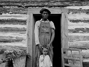 Young sharecropper and his first child by Dorothea Lange - Art Print