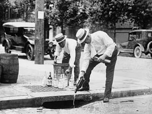 Agents Pouring liquor down a sewer on the Street - Art Print