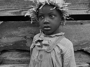 Grandson of Negro tenant whose father is in the penitentiary by Dorothea Lange - Art Print