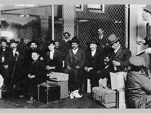 Immigrant Men Sitting at Ellis Island - Art Print