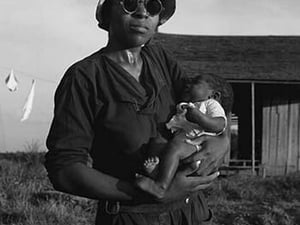 Wife and child of tractor driver by Dorothea Lange - Art Print